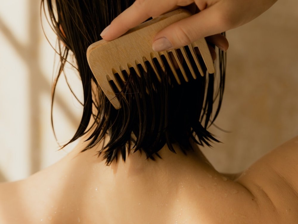 Girl combing hair