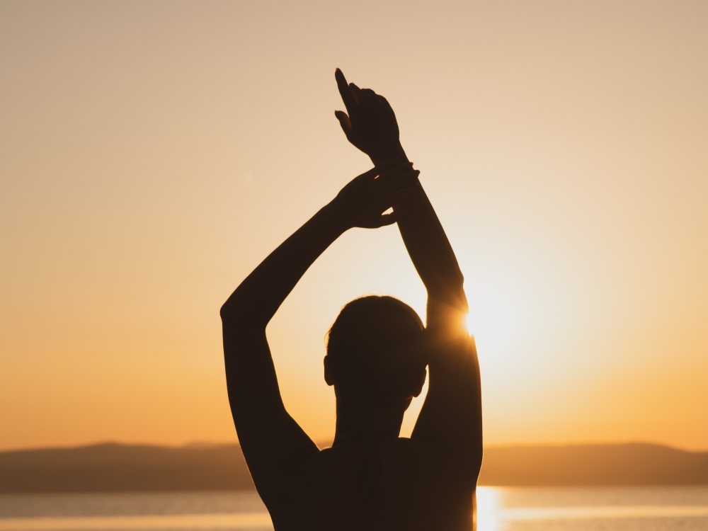 woman yoga sunset