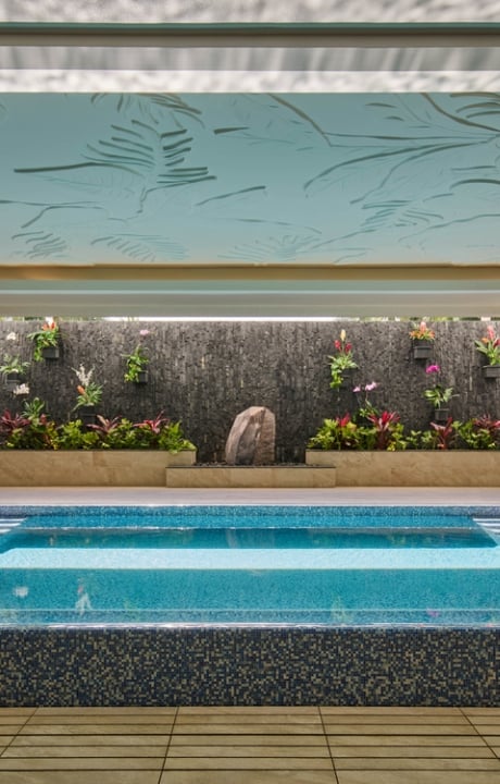 The Kilolani Spa Vitality Pool, with vibrant blue water in a calm, inviting setting.