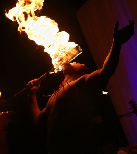 A group of fire breathers perform at a Luau