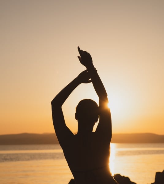 woman yoga sunset