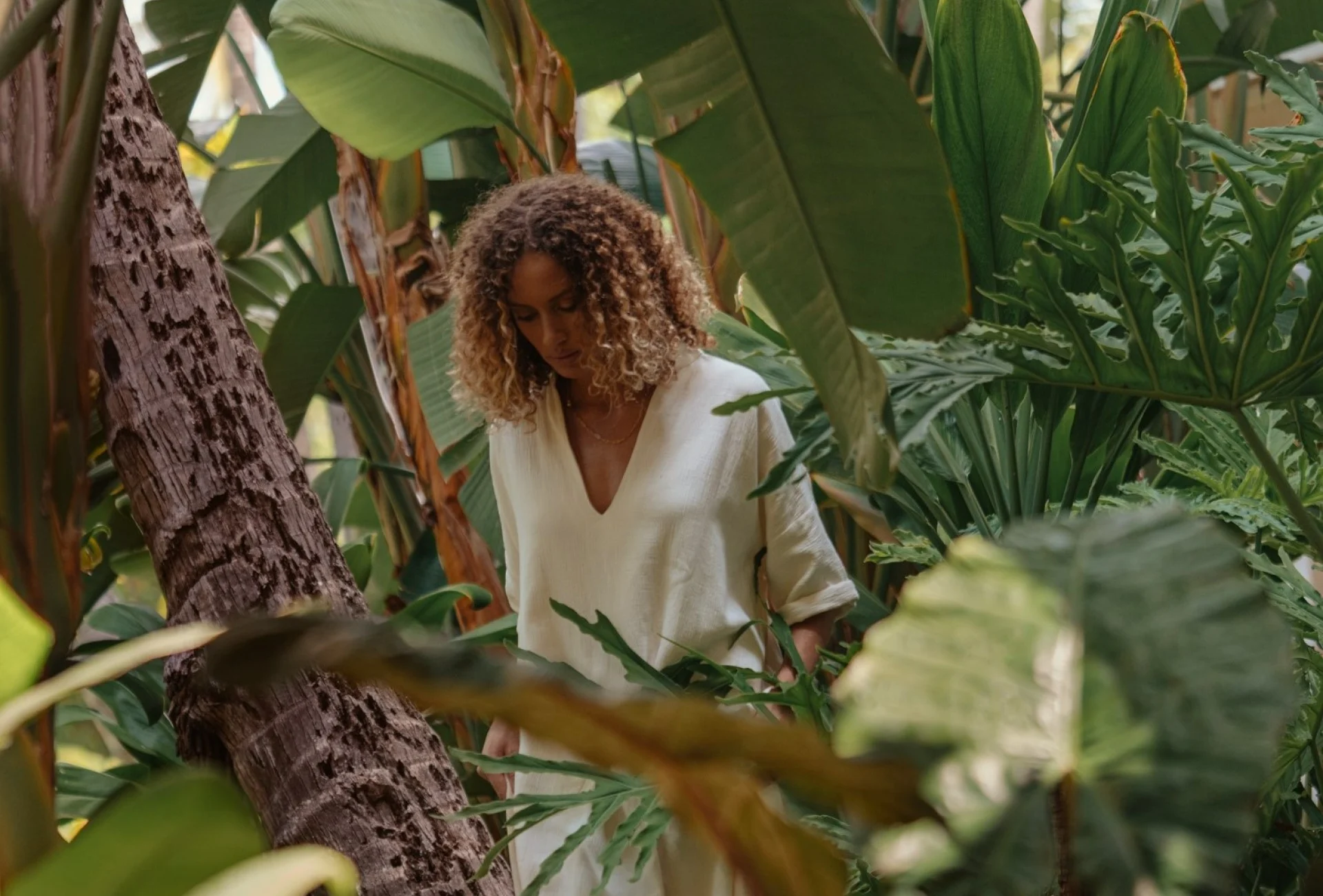 Woman walking through garden