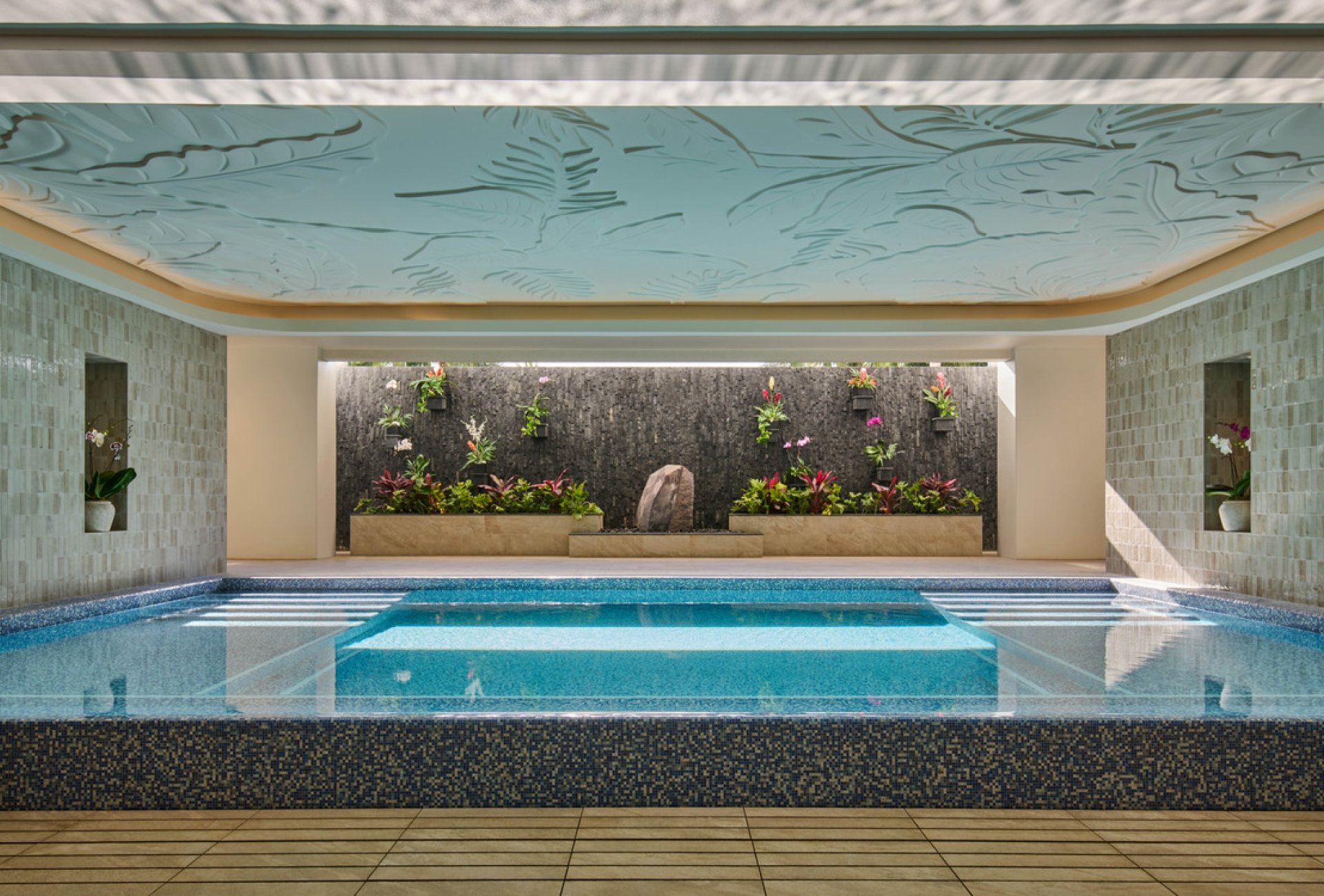 The Kilolani Spa Vitality Pool, with vibrant blue water in a calm, inviting setting.