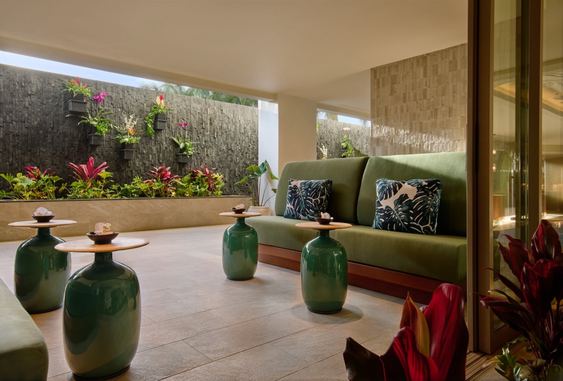 Hydrothermal Gardens Lounge featuring a vibrant green wall, creating a refreshing and inviting atmosphere for guests.