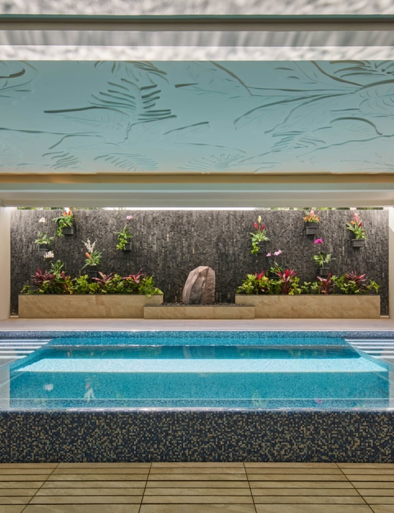 The Kilolani Spa Vitality Pool, with vibrant blue water in a calm, inviting setting.