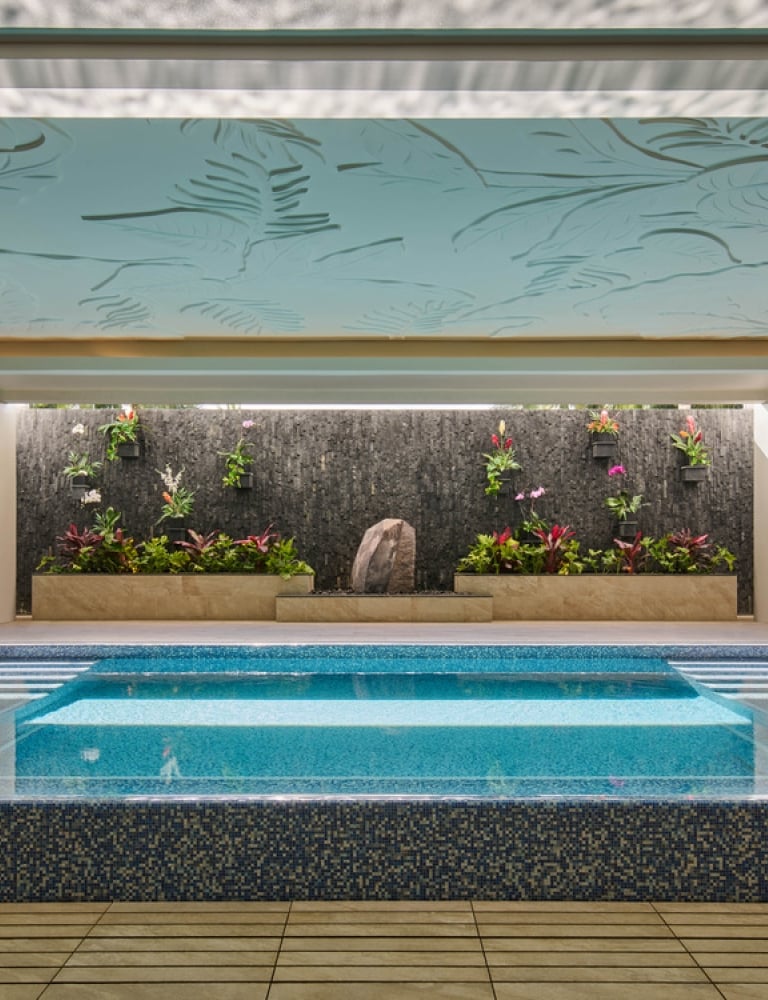The Kilolani Spa Vitality Pool, with vibrant blue water in a calm, inviting setting.